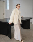 Long Nocturne off-white Saga fox fur coat side styling view