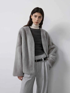 Model wearing Fireladyfur Louvre Silver Blue Natural mink V-neck jacket front view
