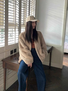 Model wearing Fireladyfur Louvre Beige Natural mink V-neck jacket indoor view