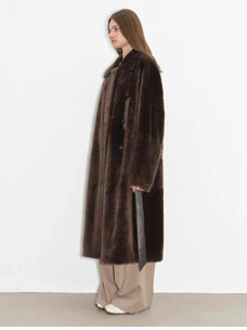 Side studio view of Mocha Phantom long shearling coat