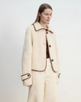 Modern Milk Cafe shearling jacket collar and contrast piping detail