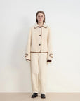 Woman wearing the off-white contrast-trim shearling jacket, full front view