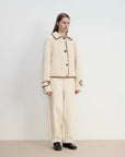 Off-white Merino shearling jacket styled outfit, side angle view