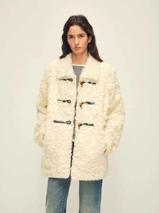 Woman wearing the Moro Garden white water ripple sheepskin coat, front view