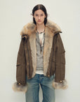 Model wearing Firelady Fur Nordic Woods Dark Brown raccoon fur down parka front view