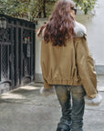 Outdoor back view of Firelady Fur Nordic Woods Khaki cropped raccoon fur parka