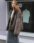 Polar Night Star Gray Brown fox fur coat in an outdoor setting, side view