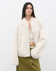Model wearing the Practical Wearism cream white Toscana sheepskin coat, front view