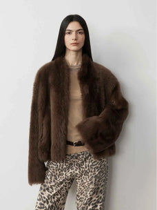 Model wearing the Practical Wearism mocha brown Toscana sheepskin coat, front view