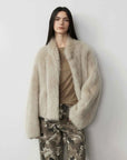 Model wearing the Practical Wearism wheat Toscana sheepskin coat, front view