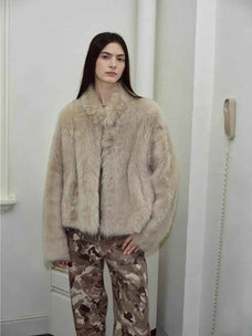 Model styling the Practical Wearism wheat drop-shoulder sheepskin coat