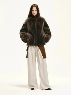 Woman styling the Quiet Warmth dark brown Merino shearling jacket