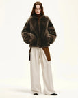 Woman styling the Quiet Warmth dark brown Merino shearling jacket