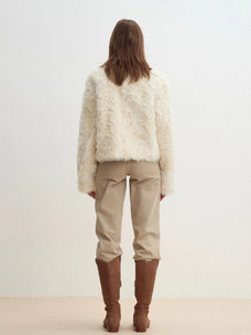 Model wearing the Rachel off-white two-tone curly wool shearling coat, back view