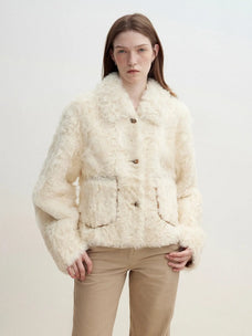 Model wearing the Rachel off-white two-tone curly wool shearling coat, close front view