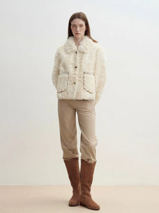 Model wearing the Rachel off-white two-tone curly wool shearling coat, relaxed full-length view
