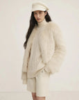 Reed Flower beige almond fox fur coat on model close-up