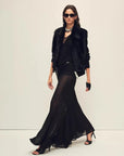 Model wearing the Silky Cocoa black shearling coat, full-length view