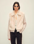 Model wearing the Silky Cocoa dusty pink shearling coat with detachable sleeves