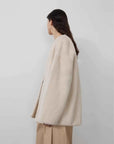 Swiss Snow Pearl Beige mink coat on model, side and back view