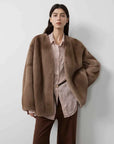 Swiss Snow Pastel mink coat on model, front view