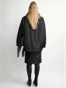 THE ARTM women's Black detachable fur collar nylon down parka back view on model