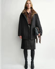 THE ARTM women's Black detachable fur collar nylon down parka full-body front view on model