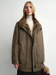 Model wearing THE ARTM women's Yellow-green detachable fur collar nylon down parka front view