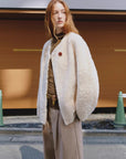 Urban Home off-white sweetheart neckline shearling coat side street view