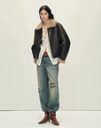 Woman wearing the Vintage Reverie crackled brown shearling jacket, full-length view
