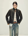 Woman styling the Vintage Reverie shearling jacket with raised collar
