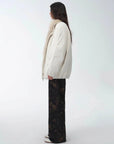 Side view of Fireladyfur Warm Dialogue Original White fox fur down parka on model