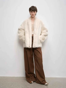 Winter Love Island off-white long lapel shearling coat full-length model view