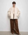 Winter Love Island off-white long lapel shearling coat full-length model view