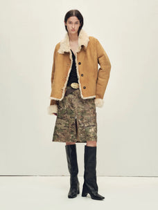 Woman styling the Winter Mochi tea apricot shearling coat, full-length view