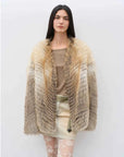 Model wearing Yukino Dream Golden Island Fox natural color coat, front view
