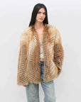 Model wearing Yukino Dream Red Fox natural color coat, front view