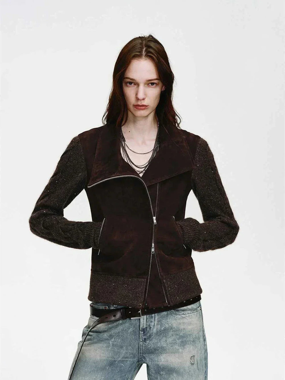 Dark leather jacket worn over a light spring base