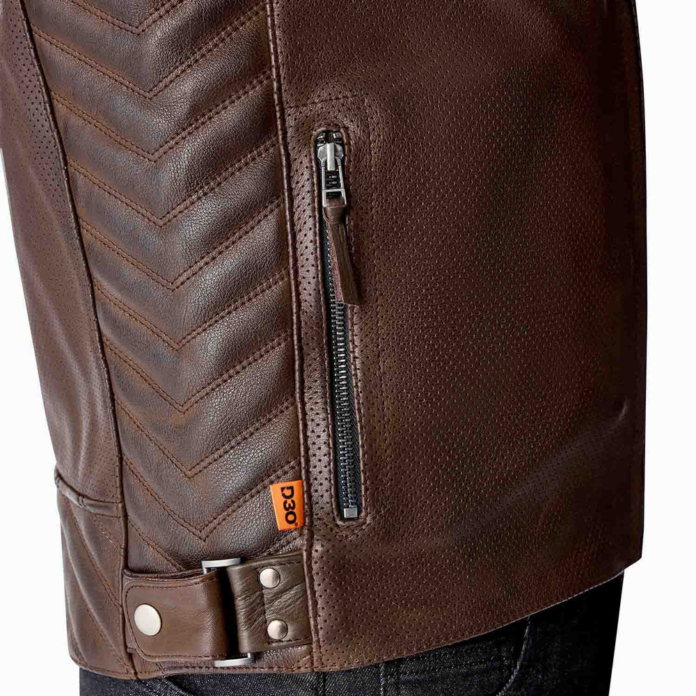 Close view of RST Roadster Air brown perforated leather beside a zip pocket and waist adjuster