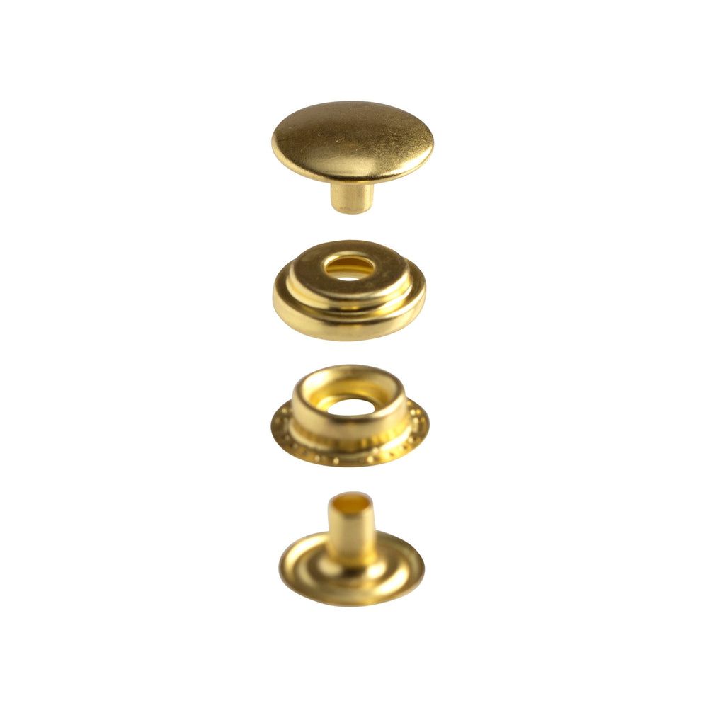 Four separated gold-tone snap components: cap, socket, stud and post