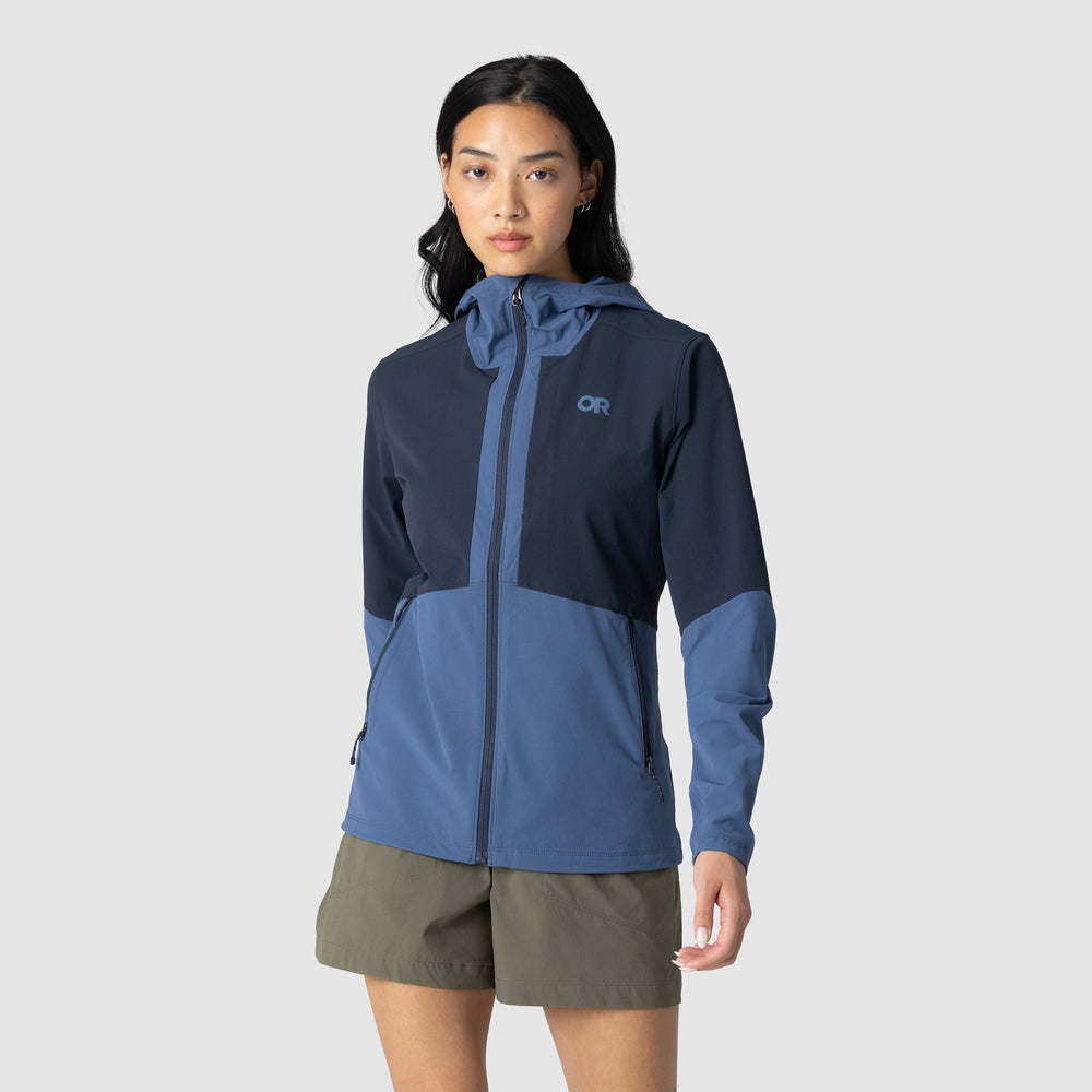 Woman wearing a blue Outdoor Research Ferrosi hooded jacket