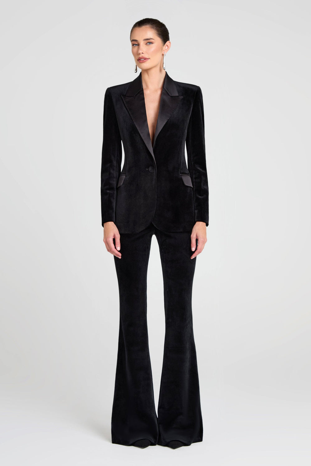 NADINE MERABI Beatrice black velvet blazer with satin peak lapels and a front button, shown on a model