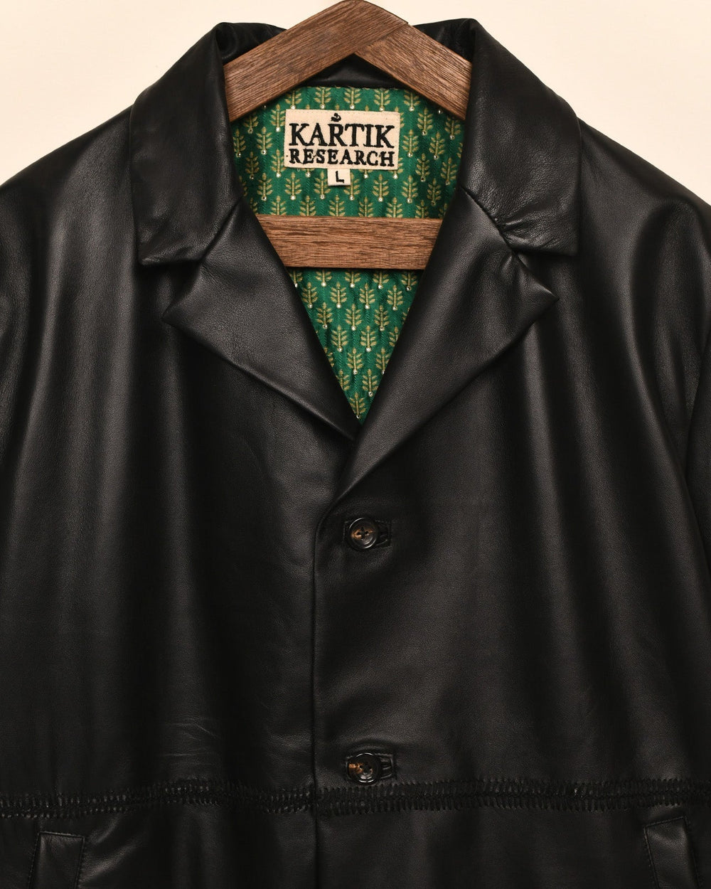 Dark Kartik Rabari leather blazer close view with tonal stitching across the waist