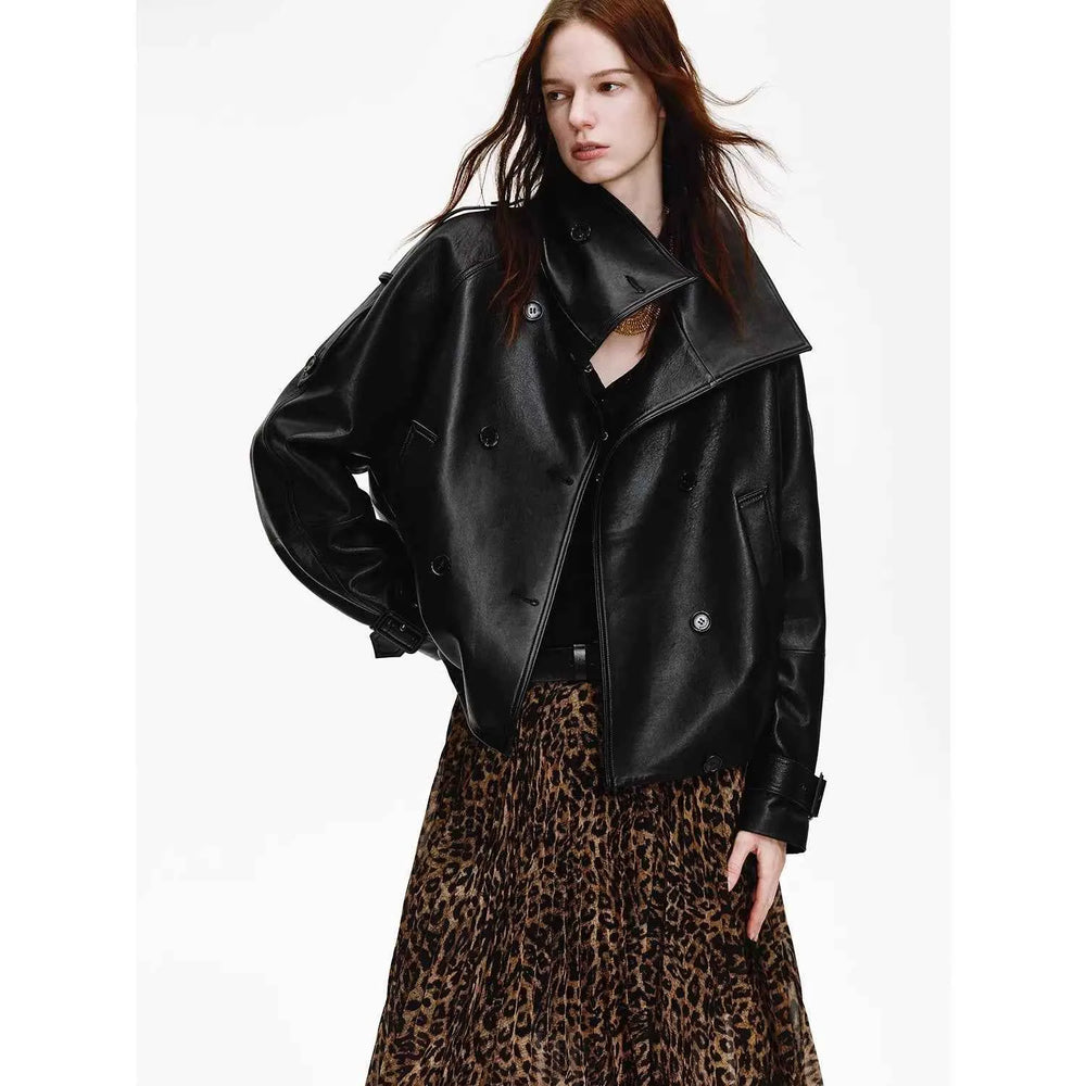 Black leather jacket styled over a fluid leopard-print skirt instead of denim