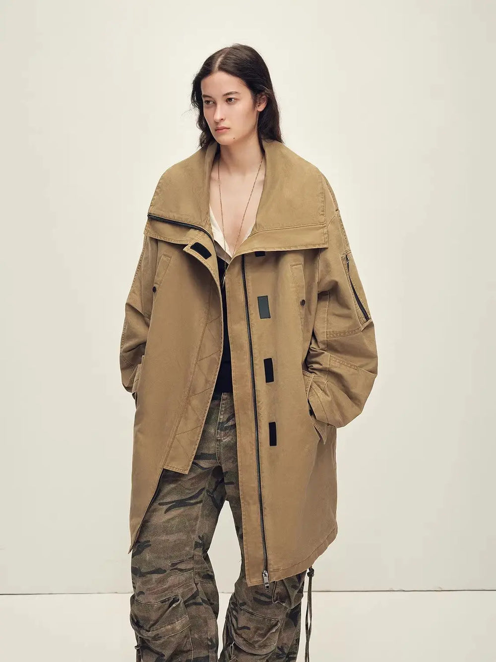 Swan Feather Collection roomy khaki coat with no visible neckline fur in this styled view, over loose patterned trousers