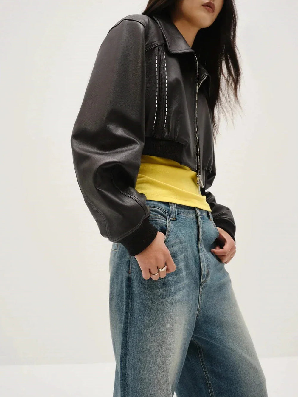 Leather jacket side detail showing pocket opening and panel construction