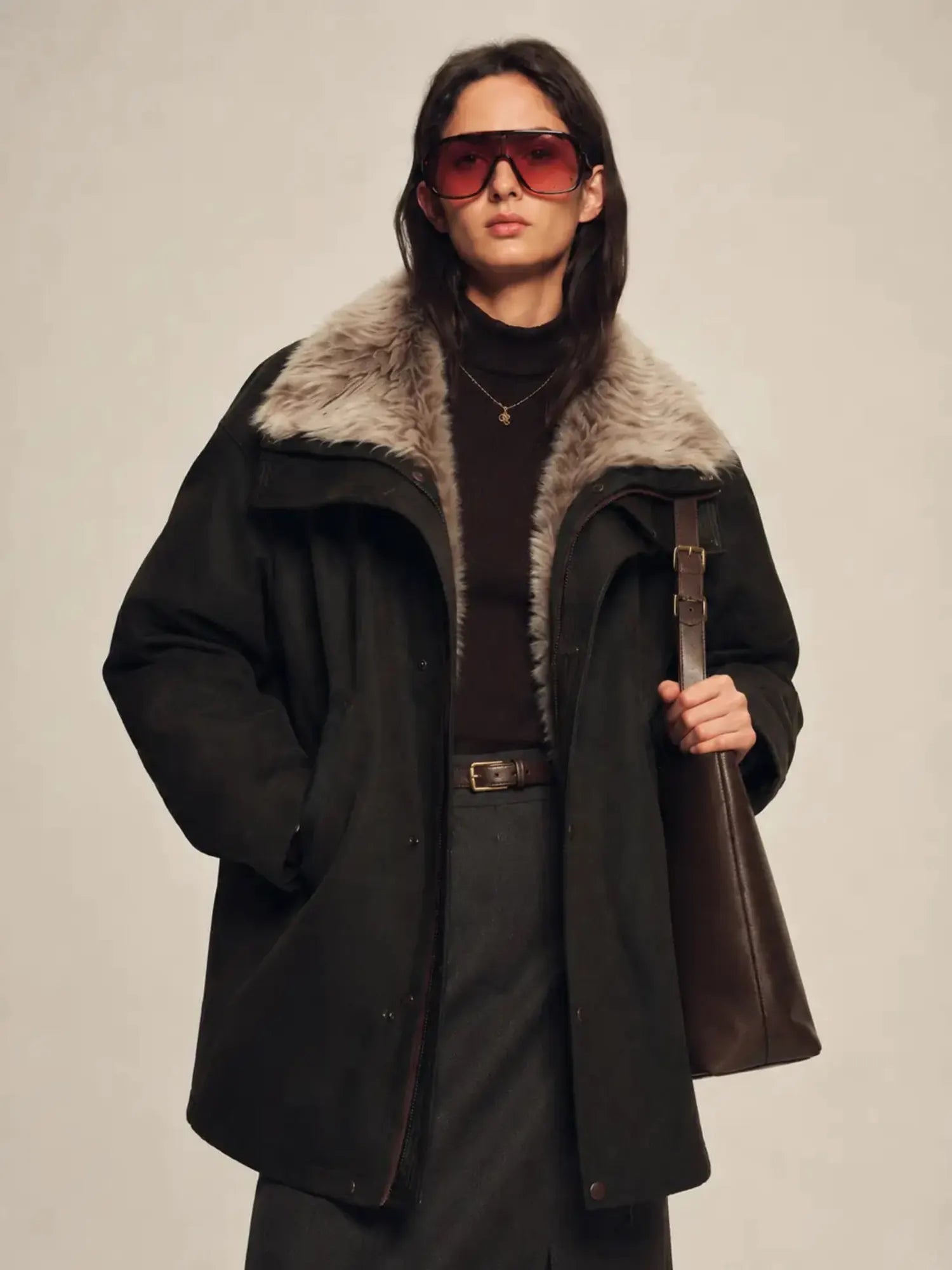 Model wearing Firelady Fur Ode to the Stars black 90% goose down parka with detachable Tokaj fur collar
