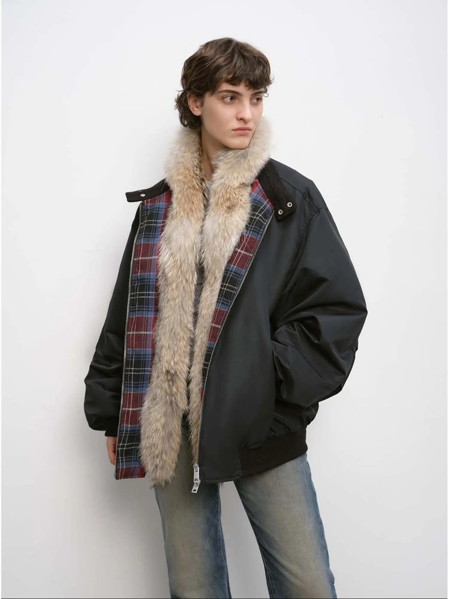 Model wearing Firelady Fur Urban Warmth women's Black lightweight parka with detachable wolf fur collar front view