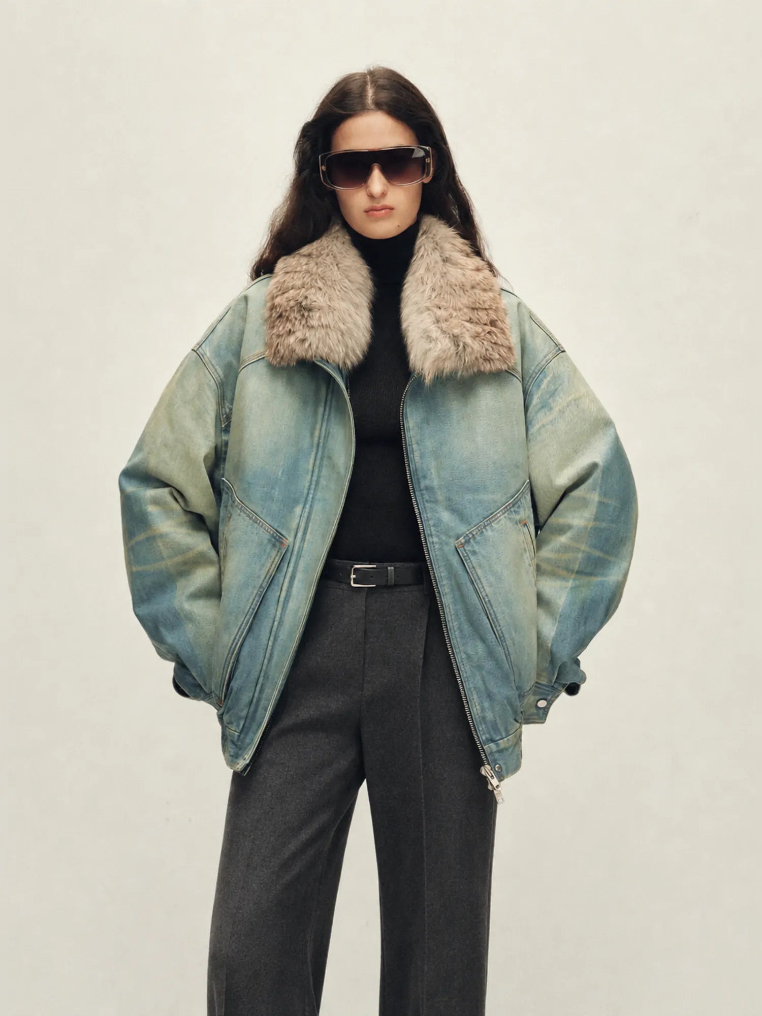 Model wearing Firelady Fur Warm Mist Glass women's Blue denim parka with SAGAFURS fox fur collar front view