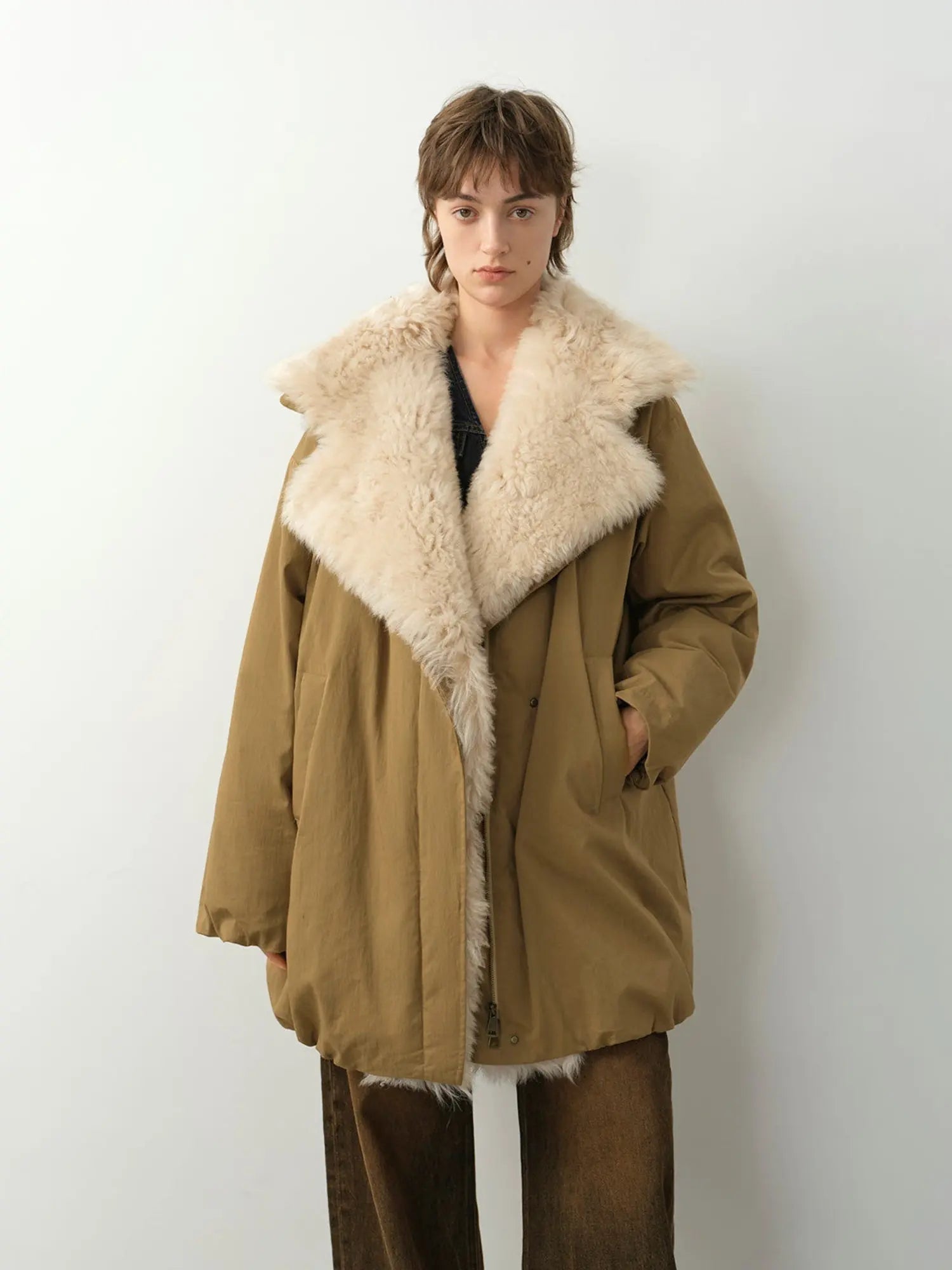 Model wearing Fireladyfur Modern Introduction women's Khaki Sheepskin goose down parka with Tuscan wool collar front view